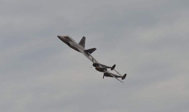 Lockheed P-38 Lightning — - US Air Force F-22 and P-38 flying formation at the Power on the Prairie Airshow - 2012 in Sioux Falls SD