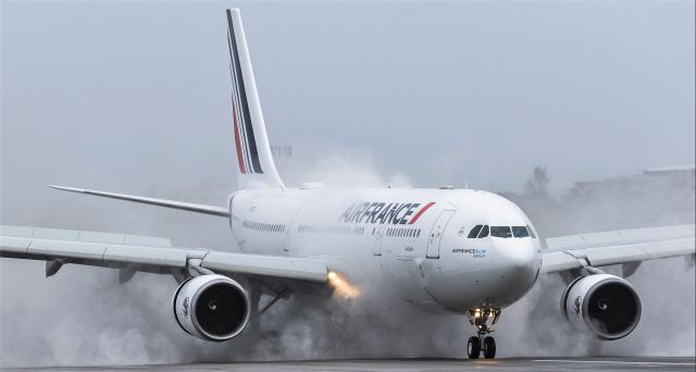 Airbus A330-200 (F-GZCF) - Air France A330-200 Avignon F-GZCF applying positive breaks after landing on St Maarten during inclement weather from tropical storm Laura. 22/08/2020