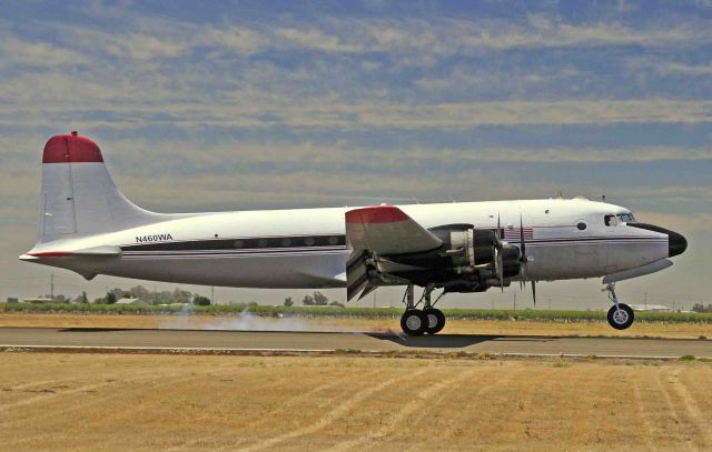 Douglas C-54 Skymaster (N460WA) - Douglas C-54 Skymaster with Sam and Ryan performing a full-stop at Merced Regional Airport (KMCE)