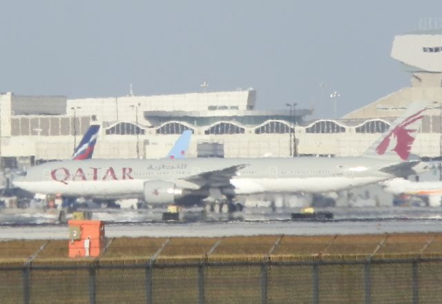 BOEING 777-300ER (A7-BAI) - Basking"In the heat of the tarmac