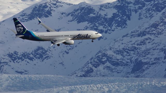 Boeing 737-800 (N524AS) - Walking the dog in the Mendenhall Wetlands, under JNU approach.  Mendenhall Glacier in the background.