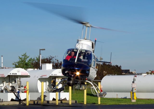 Bell JetRanger (N9BQ) - LINDEN, NEW JERSEY, USA-SEPTEMBER 04, 2018: A Bell Jet Ranger helicopter, registration number N9BQ, is seen taking off shortly after refueling at Linden Airport.