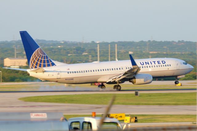 Boeing 737-800 (N33286) - 12R arrival at sunset.