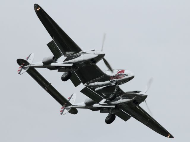 — — - The P-38 Lightning approaches Le Bourget Airport.