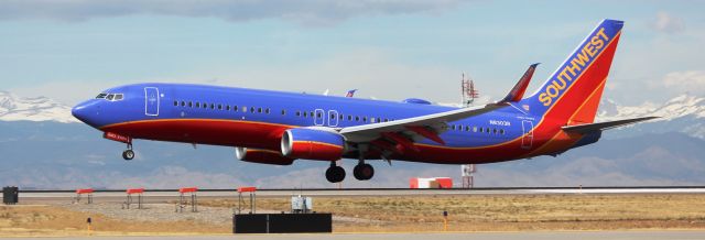 Boeing 737-800 (N8303R) - Landing on 16L.