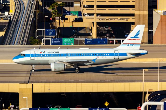 Airbus A319 (N744P) - American Airlines A319 in Piedmont retro livery taxiing at PHX on 10/29/22. Taken with a Canon 850D and Tamron 70-200 G2 lens.