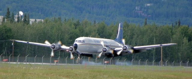 Douglas DC-6 — - DC-6 landed and smoking.