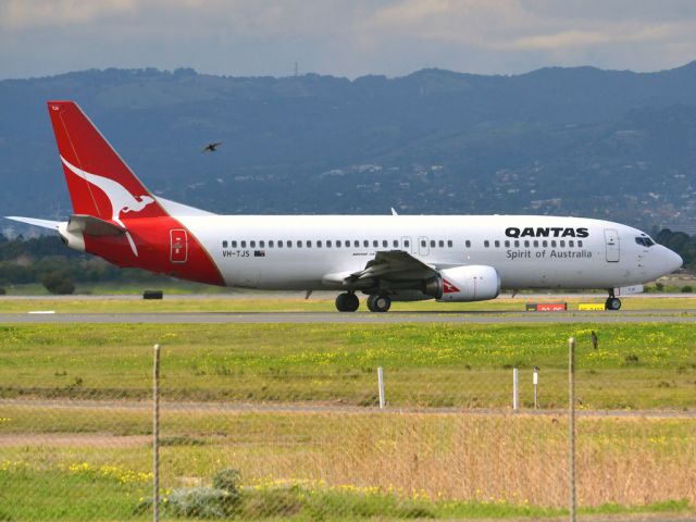 BOEING 737-400 (VH-TJS) - On taxi-way heading for take off on runway 05. Thursday 12th July 2012.