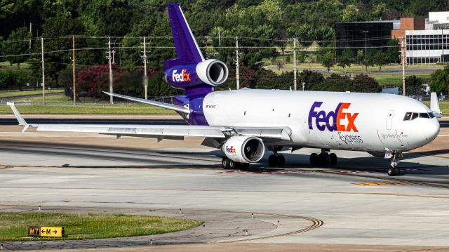 Boeing MD-11 (N614FE) - "Christy" departing runway 36L via the high-speed turnoff.