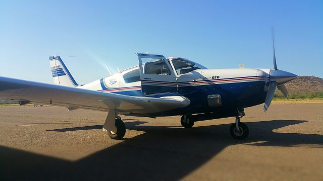 Piper PA-24 Comanche (N25M) - Sitting on my fold out seat here in San Carlos Apache. Avoiding the sun as my engineer inspects taxiway cracking. 