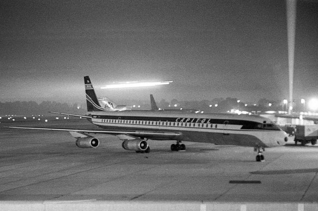 — — - DC-8 at the gate at Cleveland Hopkins Airport