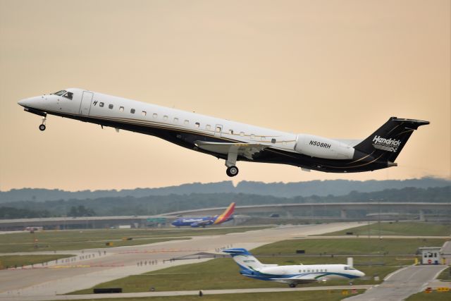 Embraer ERJ-145 (N508RH) - Hendricks Motor Sports 08-15-21. I like this photo because you can see through the cabin and five of the aircrafts windows on the opposite side of the aircraft.