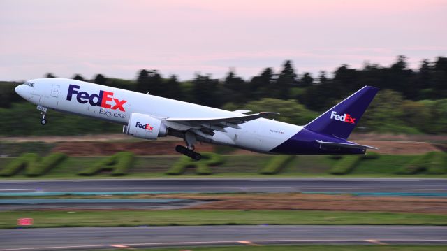 BOEING 777-200LR (N888FD) - Taking off at Narita Airport