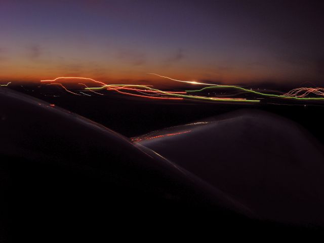 Beechcraft 18 (N9550Z) - 4 sec exposure during takeoff at dusk