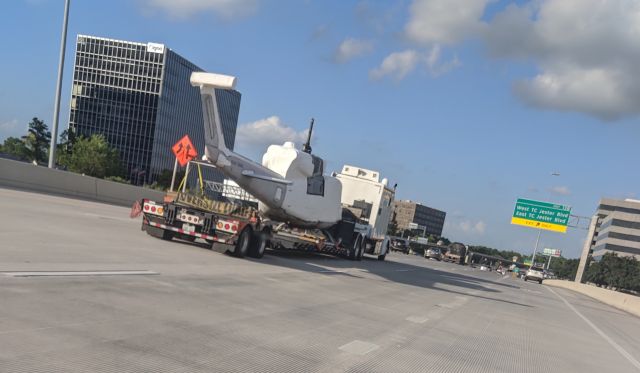 — — - This transport passed me as I was traveling 610N around 530pm yesterday.  Wish I could've taken a closer shot to see the tail number clearly.