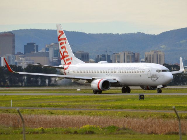 Boeing 737-700 (VH-VOK) - On taxi-way heading for take off on runway 05. Thursday 12th July 2012.