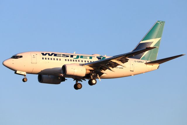 BOEING 737-600 (C-GWSJ) - Arriving at sunset Apr 20 2018