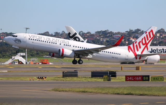 Boeing 737-800 (VH-YIT) - YIT Getting airborne off 16R nice and early. Taken from The Mound with a 70-200mm 