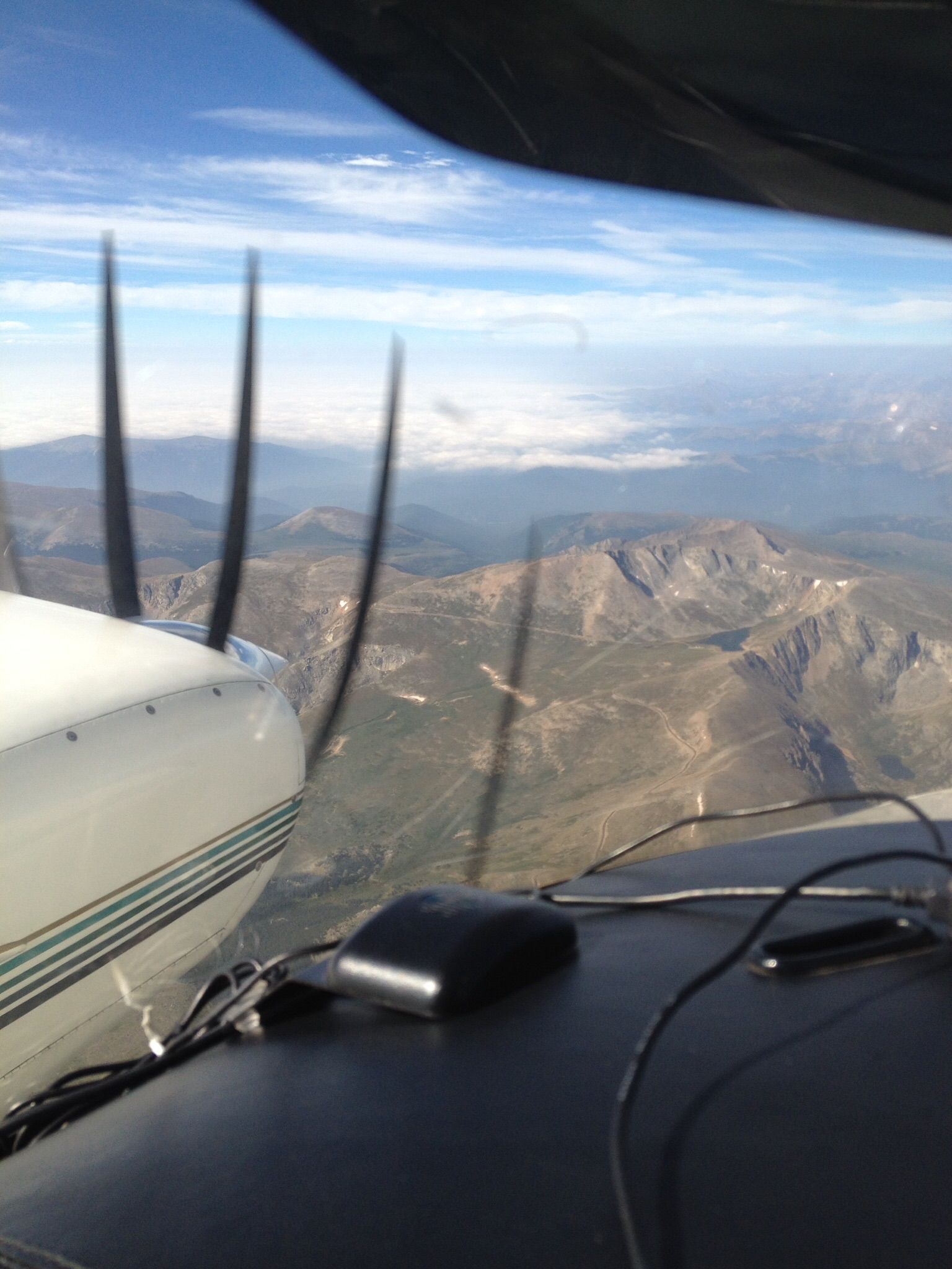 Beechcraft Duke (N500RS) - Over the Colorado Rocky Mountains,  Obscured down in the valley!