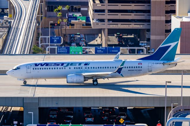 Boeing 737-800 (C-GWSR) - A WestJet 737-800 taxiing at PHX on 2/9/23 during the Super Bowl rush. Taken with a Canon R7 and Tamron 70-200 G2 lens.