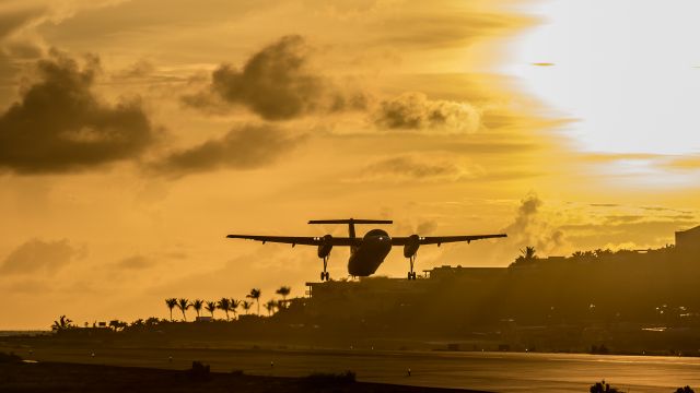 de Havilland Dash 8-100 (PH-CGB) - Coast Guard Dash 8 seen departing St Maarten at sunset.br /14/09/2021