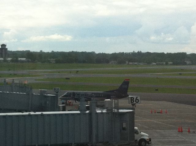 Saab 340 — - A US Airways Saab 340 preparing for departure to Boston off gate B10.