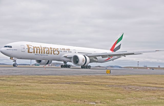 BOEING 777-300ER (A6-ECA) - Touchdown Boeing in Boston for Emirates 237 heavy from Dubai !