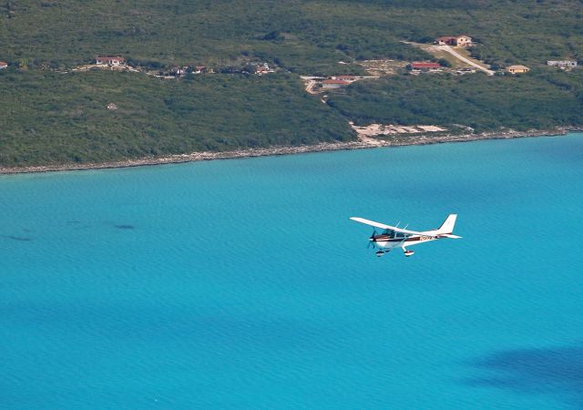 Cessna Skyhawk (N21078) - Overnighted Stella Maris and the next morning some new friends took this shot of us just off the island.