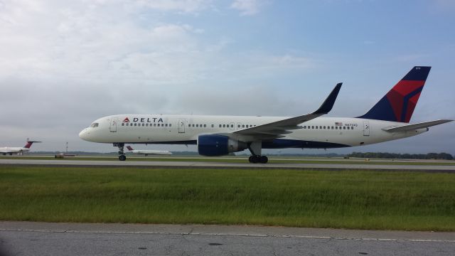 Boeing 757-200 (N6714Q) - TAKEN FROM THE SOUTH TERMINAL CELL PHONE WAITING LOT