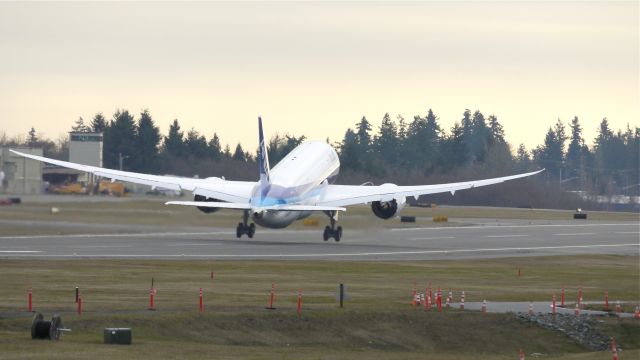 Boeing 787-8 (JA807A) - BOE104 lifts off runway 16R for a test flight on 12/23/11.