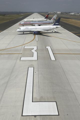 Airbus A320 (N661JB) - wide view of the brand new runway along with the first three aircraft to depart on her.they departed in the order seen here, N661JB, N188AN and N709TW.