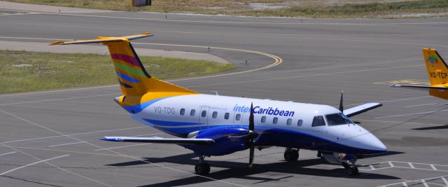 Embraer EMB-120 Brasilia (VQ-TDG) - Looking down upon the apron at Providenciales Airport.