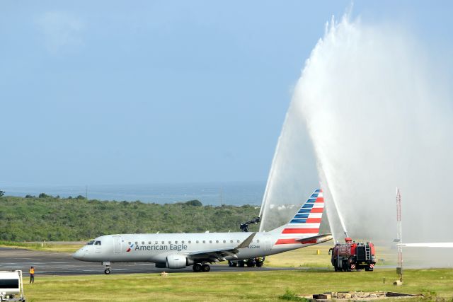 Embraer 175 (N252NN) - Inaugural non-stop commercial flight from the US mainland to Anguilla receiving a water salute after landing at the Clayton J. Lloyd International Airport on 11th December 2021.