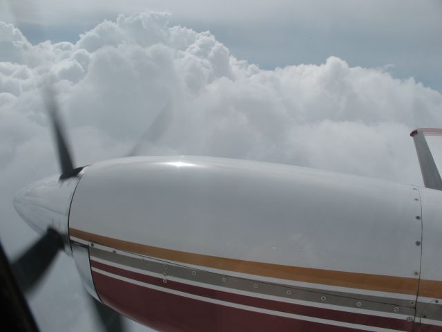 N337KC — - Cessna Conquest N337KC Climbing to flight level 260 to get above the bad weather notice the storm clouds off of our wing .