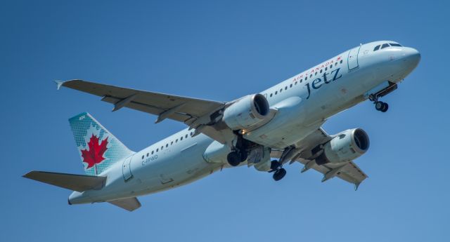 Airbus A320 (C-FPWD) - Air Canada Jetz leaves runway 06L