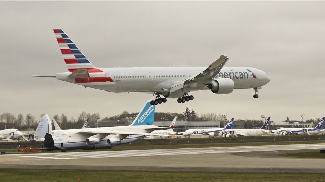 BOEING 777-300 (N721AN) - BOE305 on final to runway 16R to complete a flight test on 3/14/13. (LN:1083 cn 31546).  On the taxiway behind is ADB2712 a An-124 #UR-82009 which delivered a B748 subassembly from KAFW.