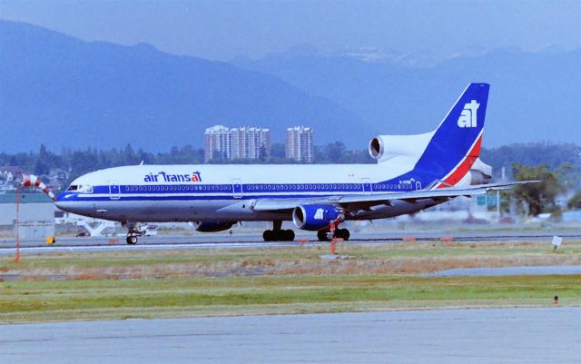 Lockheed L-1011 TriStar (C-GTSK) - CYVR/YVR - apprx date June 1996-98 Air Transat L-1011 MSN 1021 departing Vancouver BC this jet delivered new to Air Canada in 1973 and also flew with Cathay Pacific. I took this photo from the south terminal area back then and now I found a google map location with a photo platform right near where I took this see attached copy paste in Google maps,br /br /https://www.google.com/maps/place/YVR+South+Terminal+Viewing+Platform/@49.1841105,-123.1759012,1670m/data=!3m1!1e3!4m12!1m6!3m5!1s0x54860b348627a39b:0xba68ccac86348084!2sVancouver+International+Airport!8m2!3d49.1966913!4d-123.1815123!3m4!1s0x54860b28b0a1c3c3:0x9be263b5eb72832b!8m2!3d49.1812798!4d-123.1703652?hl=en