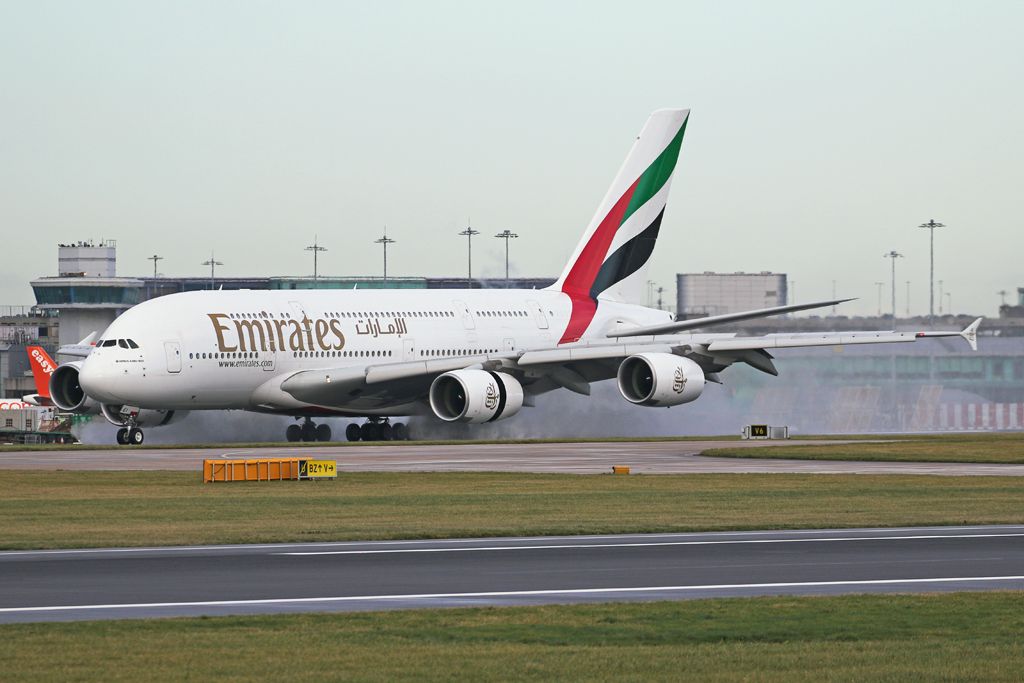 Airbus A380-800 (A6-EEI) - EK17 arriving from Dubai and clearing some water from the runway.
