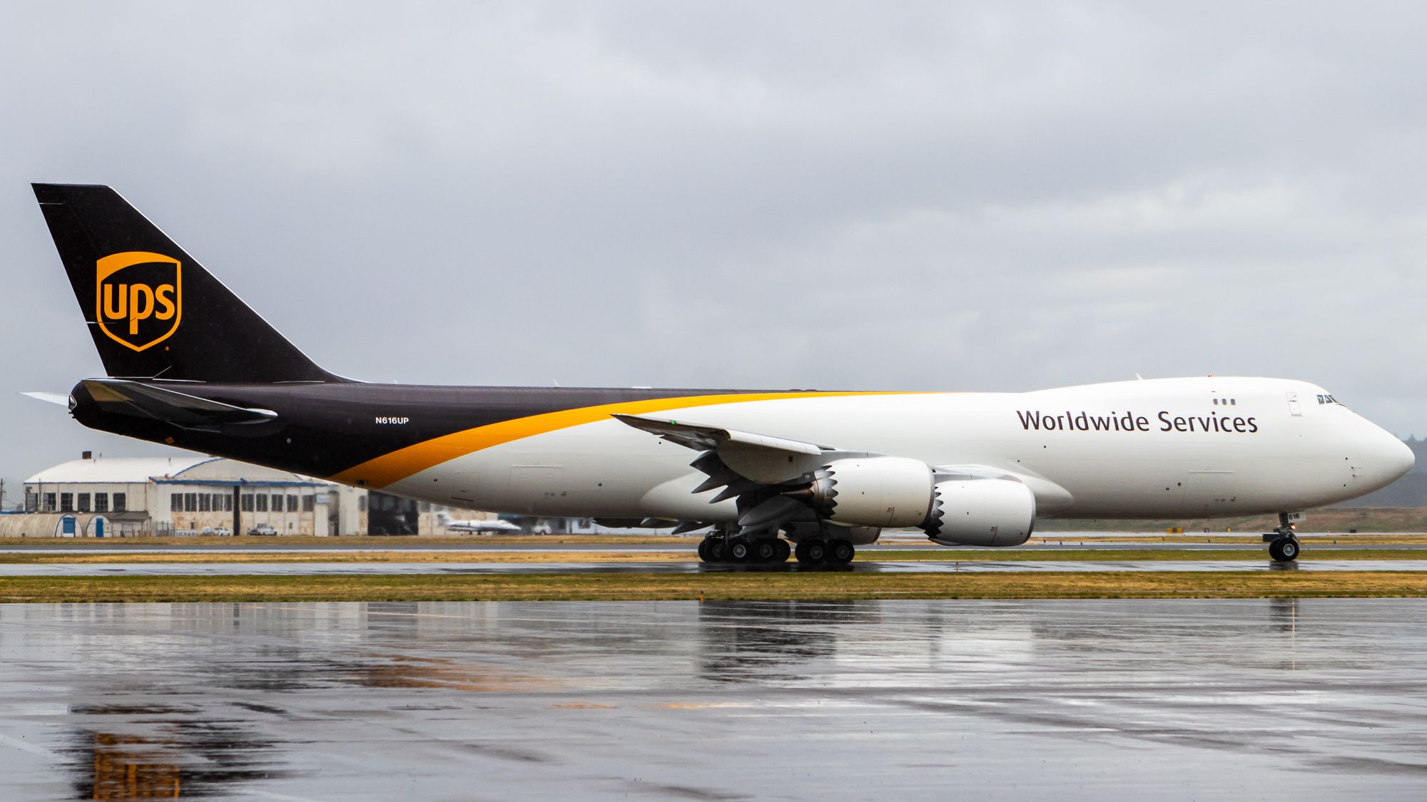 BOEING 747-8 (N616UP) - N616UP leaves Portland under some rain as BOE681 Heavy.