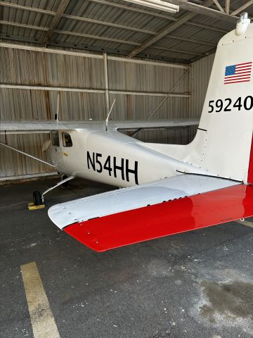 Cessna Commuter (N54HH) - Behind the plane in the hanger 