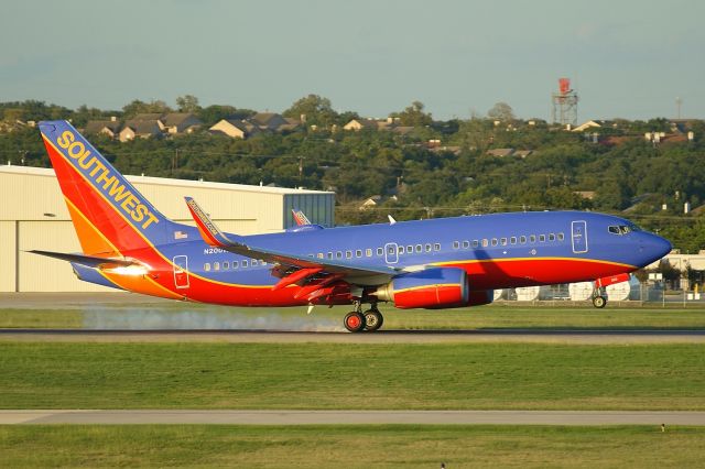 Boeing 737-700 (N200WN) - 12R arrival at sunset