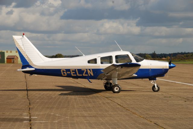 Piper Cherokee (G-ELZN) - Warrior on the ramp at Duxford in England.