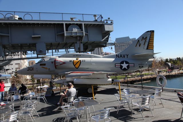 — — - Lunch with an A-4F on the converted aircraft elevator cafe area aboard USS MIDWAY in San Diego harbour.