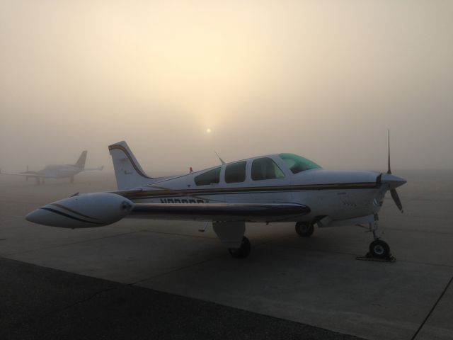 Beechcraft Bonanza (33) — - Waiting for the fog to lift.