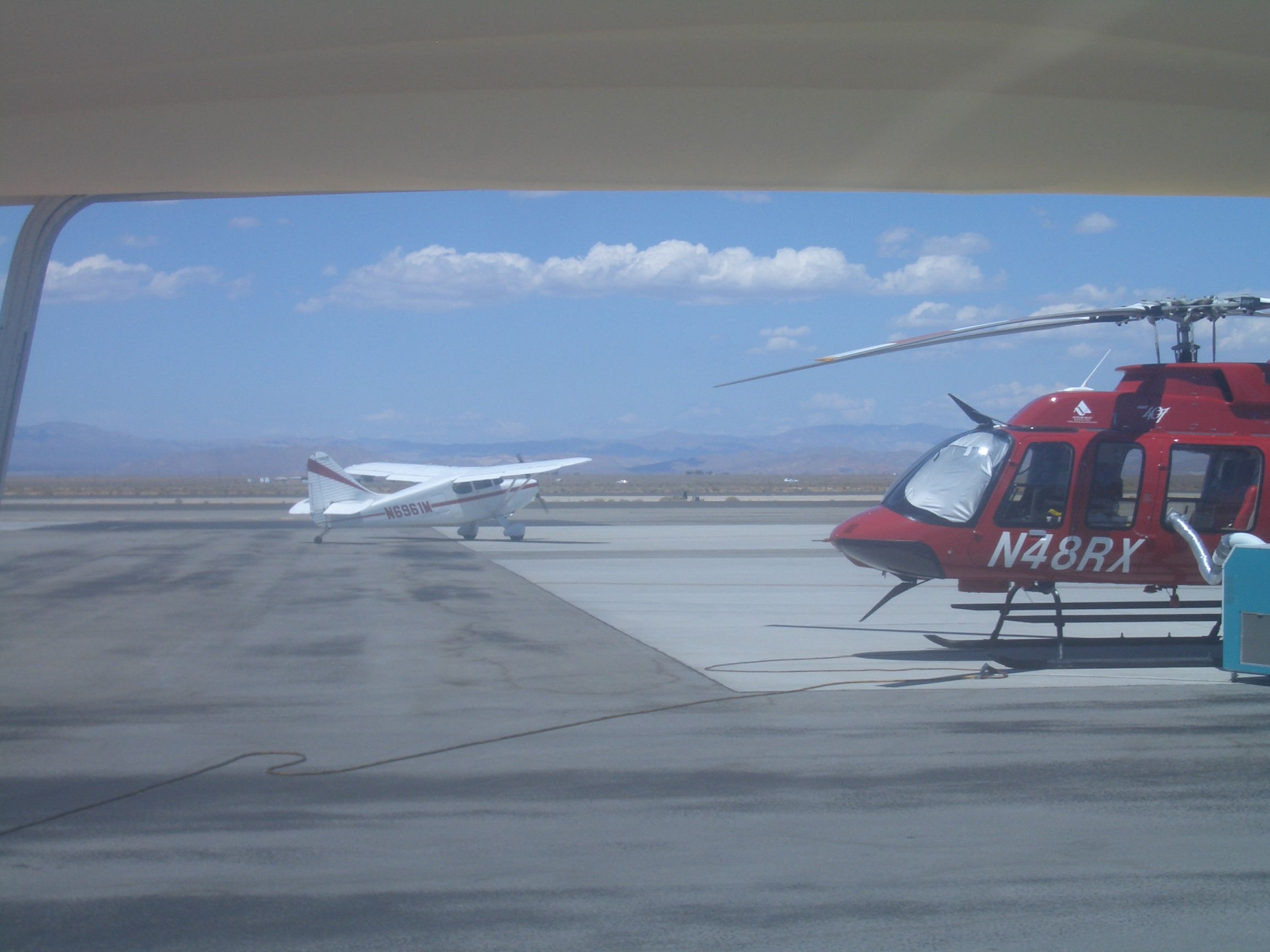 Piper 108 Voyager (N6961M) - Taxing to take off. Going past N48RX.