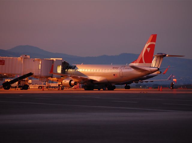N610CZ — - Compass Airlines Embraer 175 sitting on the ramp at Gate One in Missoula just as the morning sun breaks over the mountains.