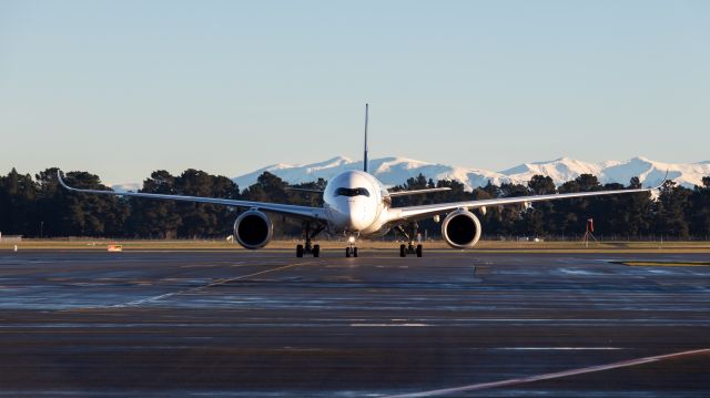 Airbus A350-900 (9V-SMG) - Singapore taxing into Christchurch with the snowy maintains in the back 