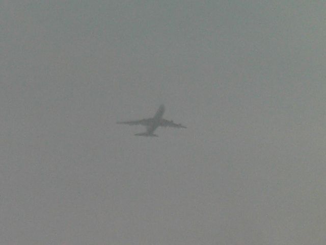 Boeing 747-400 (CLX719) - Cargolux Boeing 747-400 coming through the clouds after departing EGMH manston