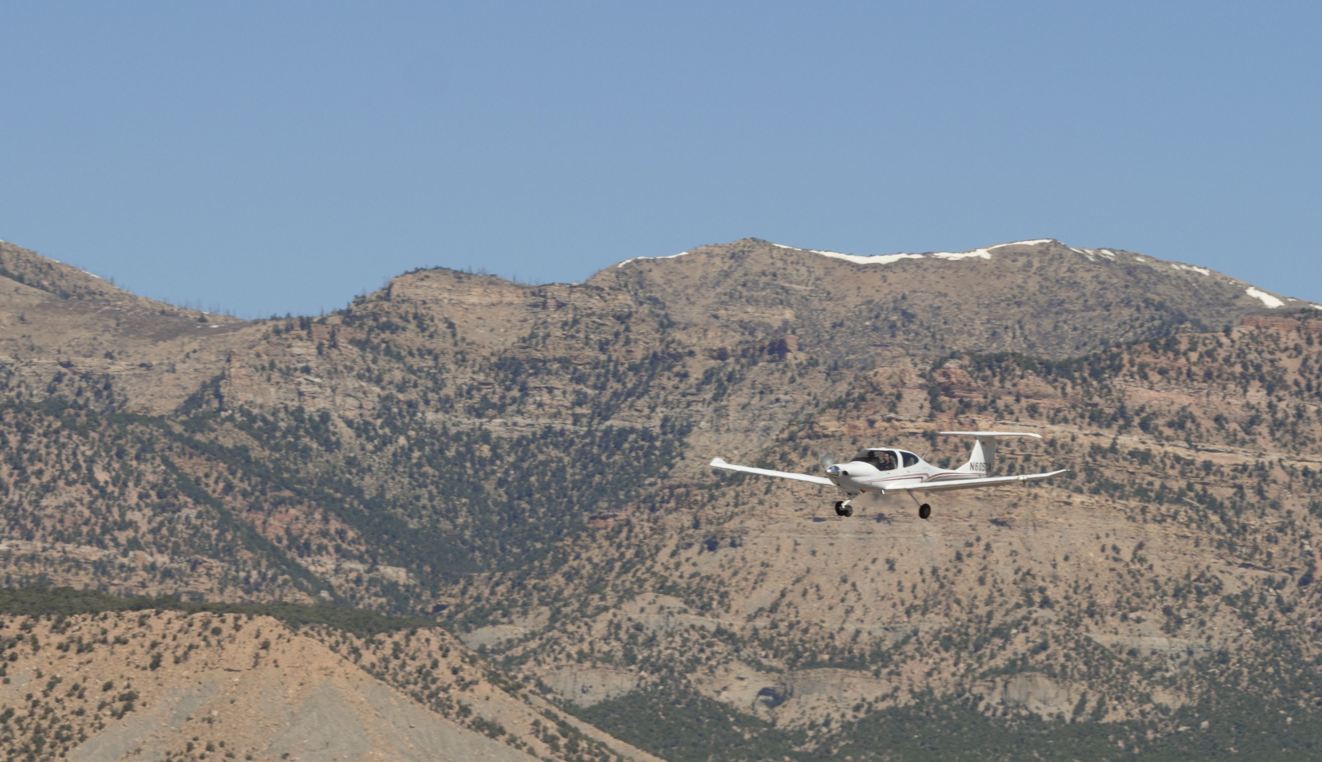 Diamond Star (N605CA) - Take off after fuel stop in Price, Utah.  Student pilot & instructor from Utah State University on their way to KSGU (4/10/2021). Captured 1/200 @ f/10 ISO 200 - 150mm focal length.
