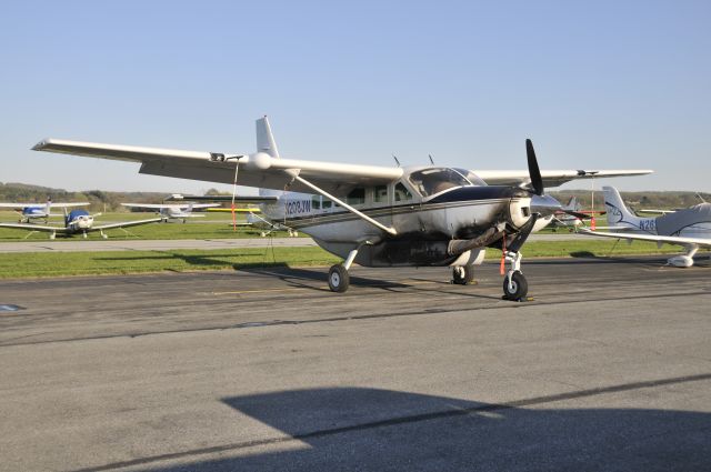 Cessna Caravan (N208JW) - Seen at KFDK on 4/23/2009.  This a/c has an interesting history, having flown in Africa, and then tours over the Grand Canyon.  Not sure about the apparent fire damage.